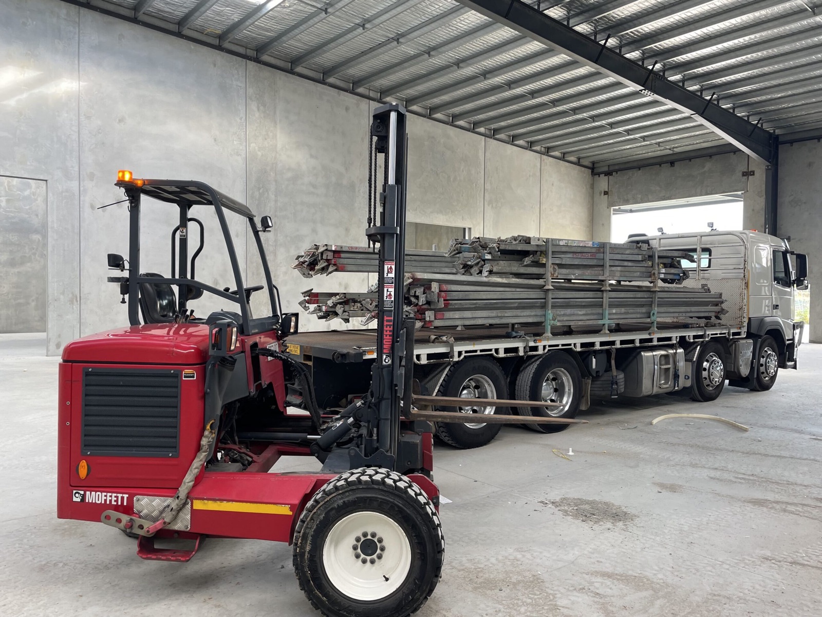 Mr Moffett truck with all-terrain forklift on site